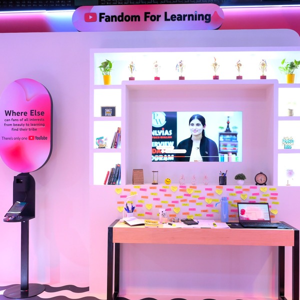 A 'Fandom for Learning' display that includes a screen, a laptop and colourful post-it notes.